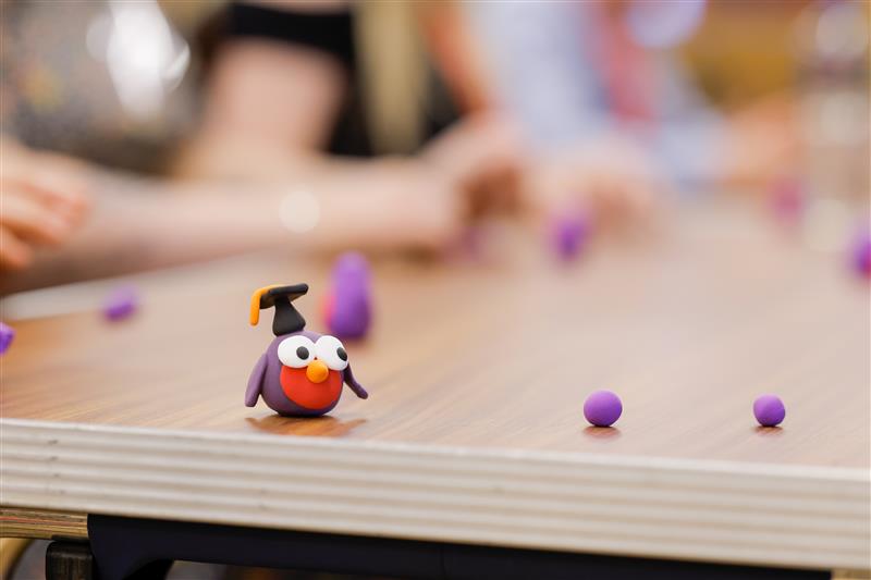 clay graduation bird